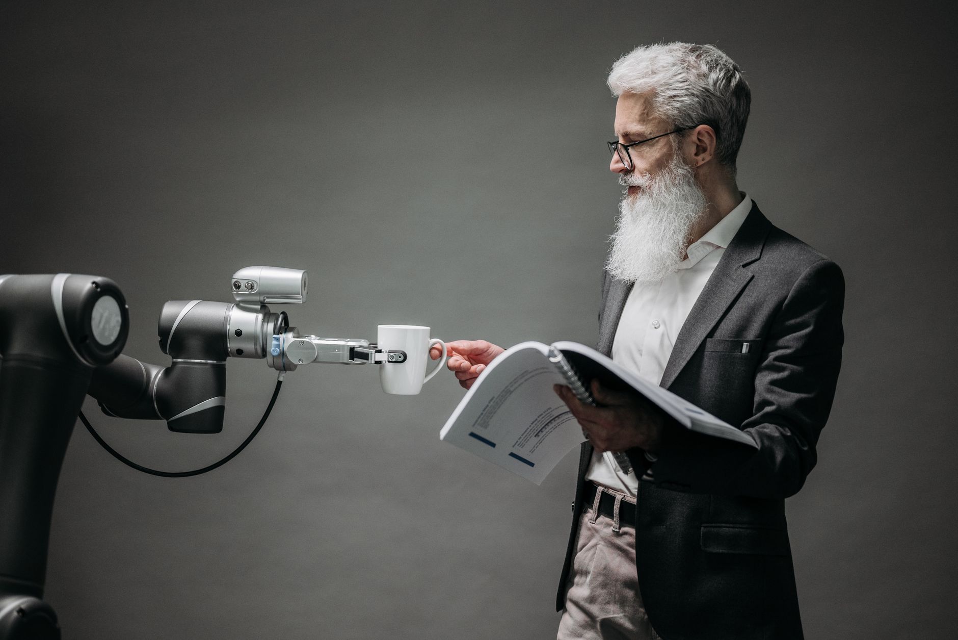 A scientist interacts with a robot helper, demonstrating modern technological innovation. — Student Travel in Hull Made Simpl