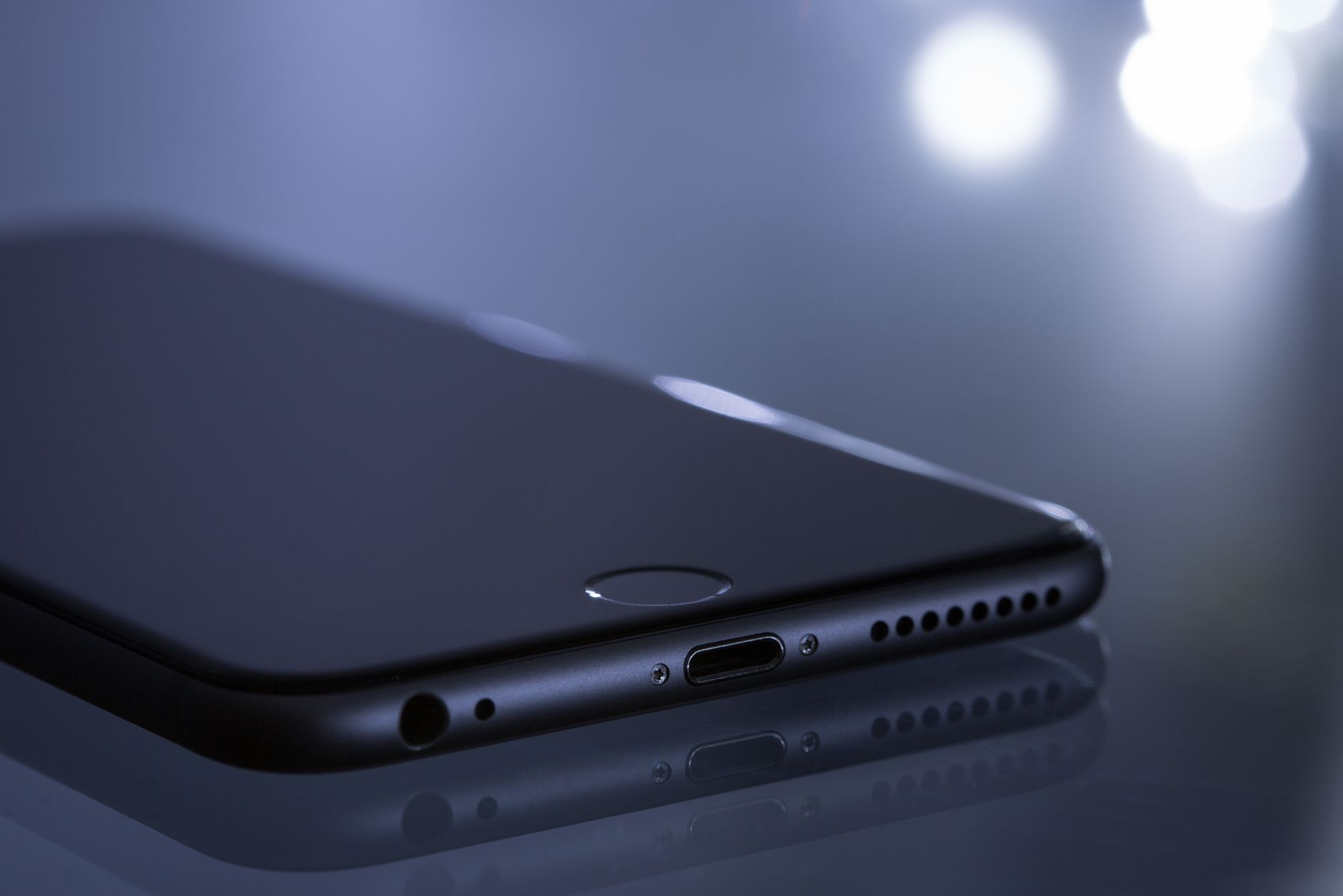 Close-up of a sleek smartphone with a blurred bokeh reflection, showcasing modern technology design. — Student Travel in Hull